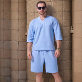 The 2025 new men's summer suit is a casual and versatile solid-color jacquard V-neck short-sleeved T-shirt with two shorts
