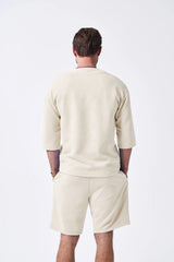 The 2025 new men's summer suit is a casual and versatile solid-color jacquard V-neck short-sleeved T-shirt with two shorts