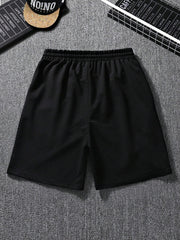 Men Cartoon & Letter Graphic Drawstring Waist Shorts