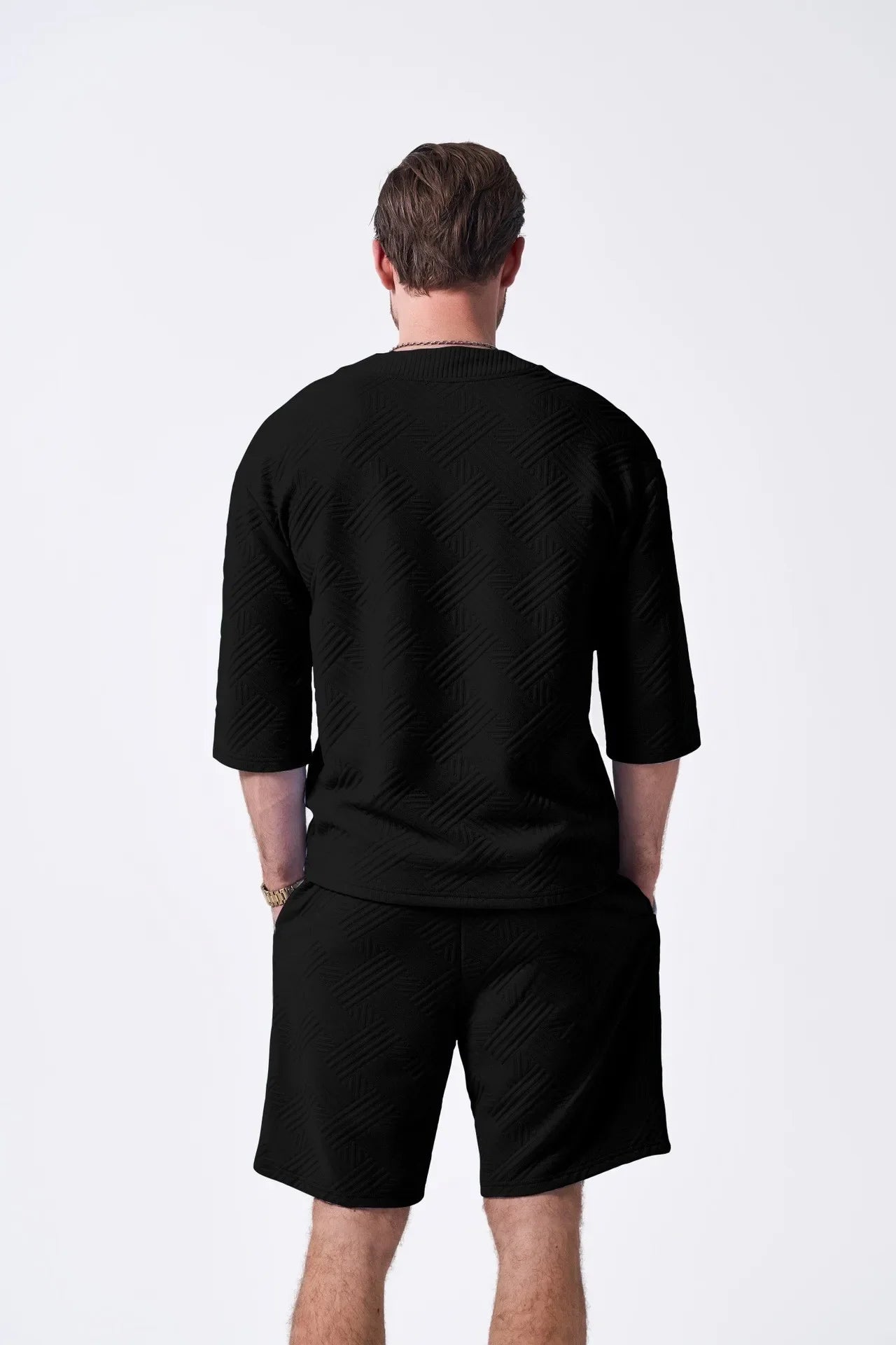 The 2025 new men's summer suit is a casual and versatile solid-color jacquard V-neck short-sleeved T-shirt with two shorts