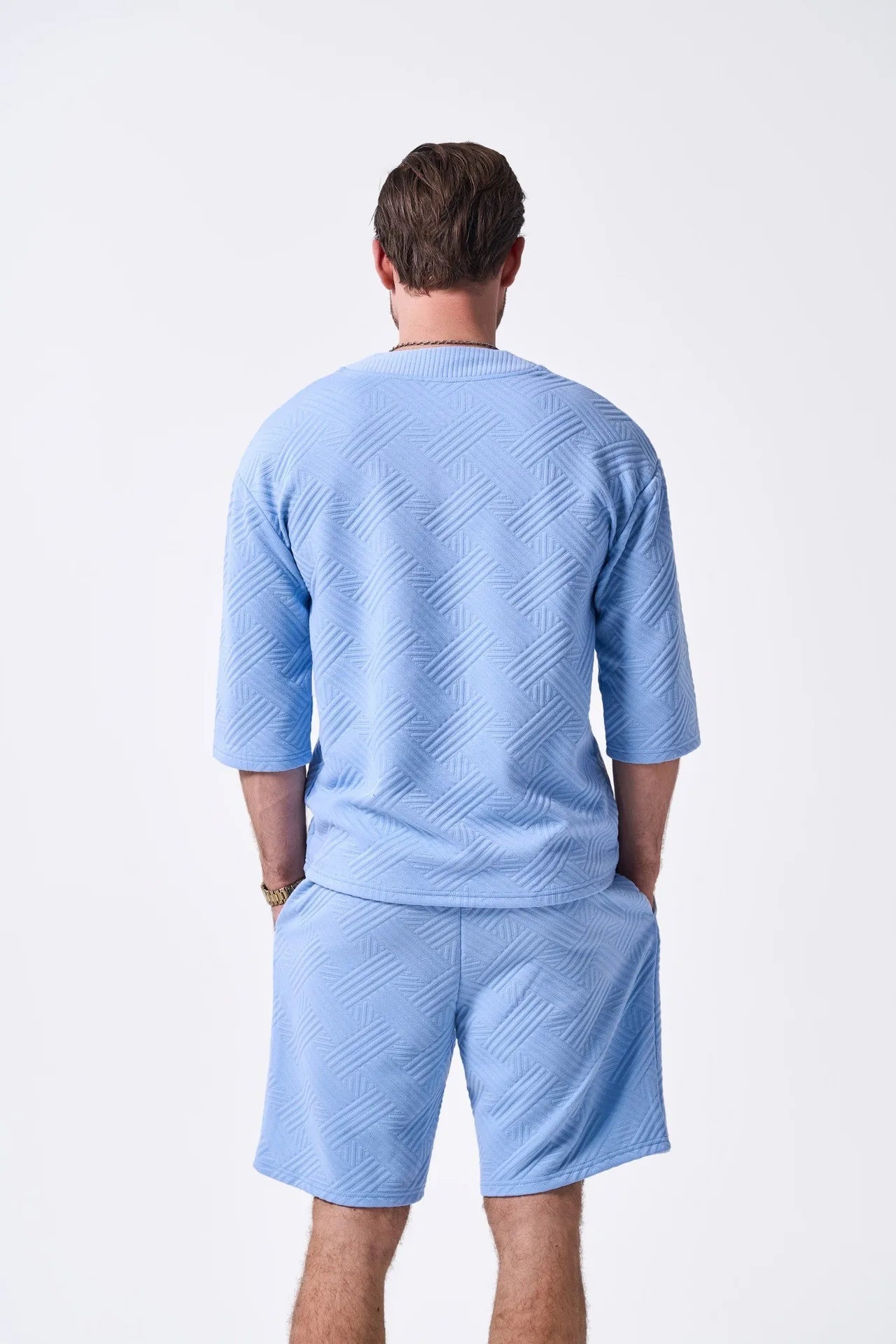 The 2025 new men's summer suit is a casual and versatile solid-color jacquard V-neck short-sleeved T-shirt with two shorts