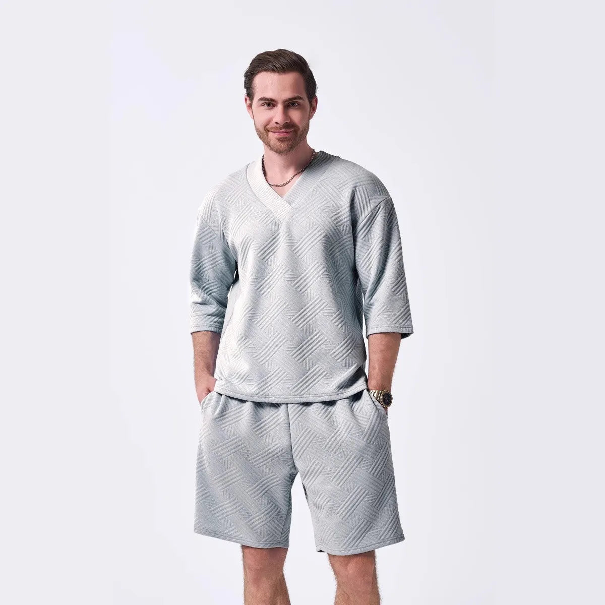 The 2025 new men's summer suit is a casual and versatile solid-color jacquard V-neck short-sleeved T-shirt with two shorts