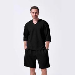 The 2025 new men's summer suit is a casual and versatile solid-color jacquard V-neck short-sleeved T-shirt with two shorts